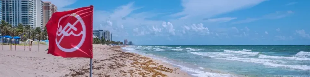 Red Flag for Warning of unsafe sea for swimming at Florida beach